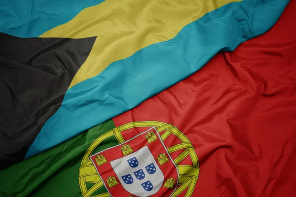 portekiz ve bahamalar ulusal bayrağı renkli bayrak sallayarak.