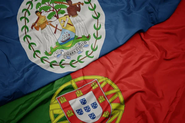 portekiz ve belize ulusal bayrağı renkli bayrak sallayarak.