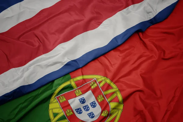 portekiz ve kosta rika ulusal bayrağı renkli bayrak sallayarak.