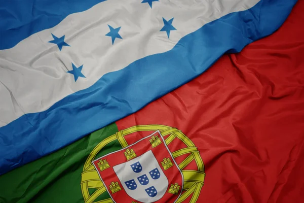 portekiz ve honduras ulusal bayrağı renkli bayrak sallayarak.
