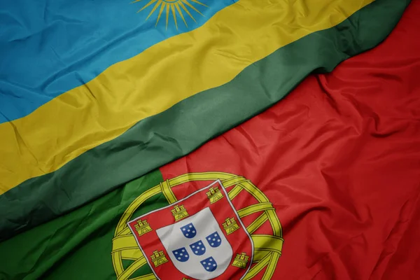 portekiz ve ruanda ulusal bayrağı renkli bayrak sallayarak.