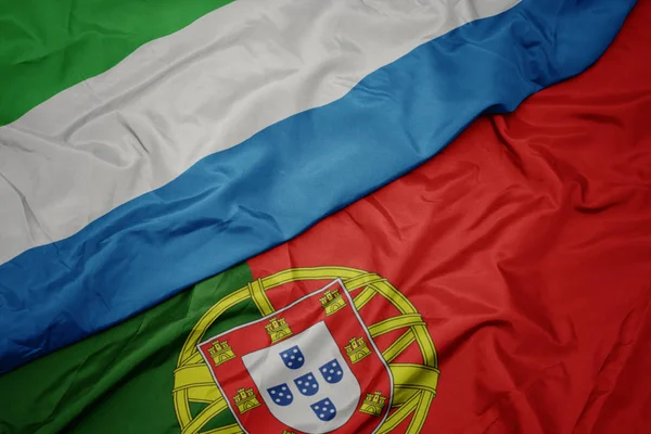 portekiz ve sierra leone ulusal bayrağı renkli bayrak sallayarak.