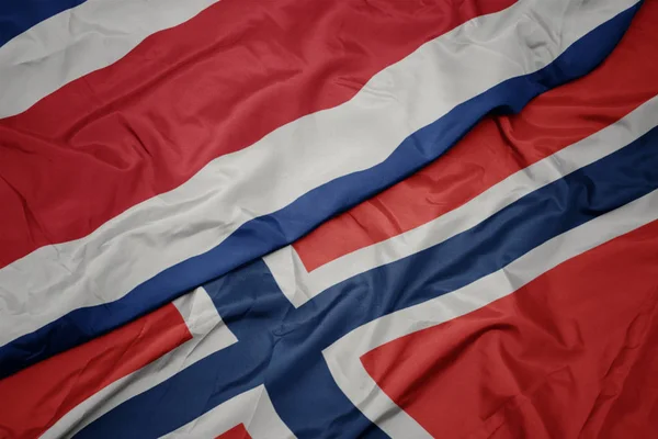 Waving colorful flag of norway and national flag of costa rica. — Stock Photo, Image