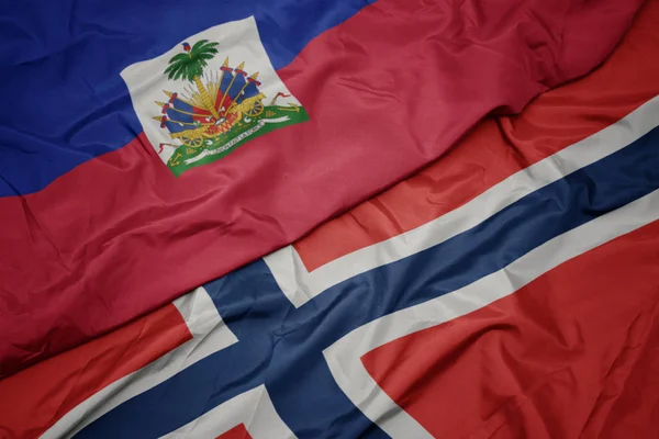 Waving colorful flag of norway and national flag of haiti. — Stock Photo, Image