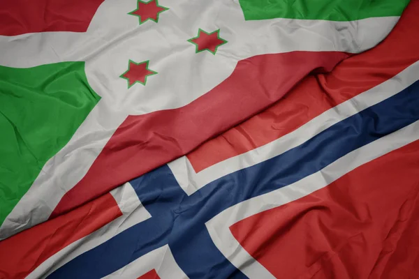 Sventolando bandiera colorata di norway e bandiera nazionale del Burundi . — Foto Stock