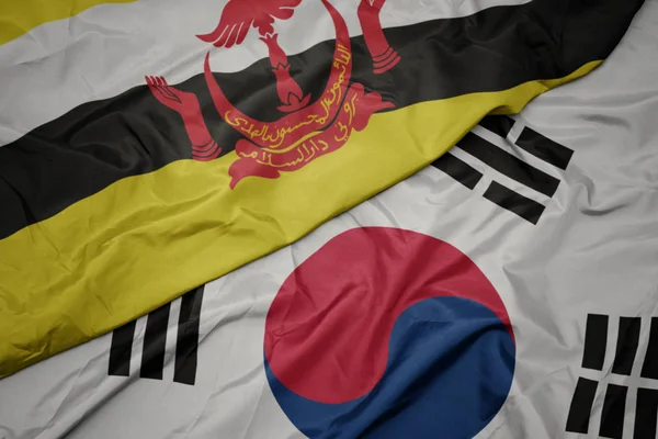 Розмахуючи барвистий Прапор Південної Кореї і Національний прапор Брунею. — стокове фото