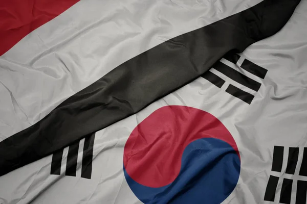 Розмахуючи барвистий Прапор Південної Кореї і державного прапора Ємену. — стокове фото