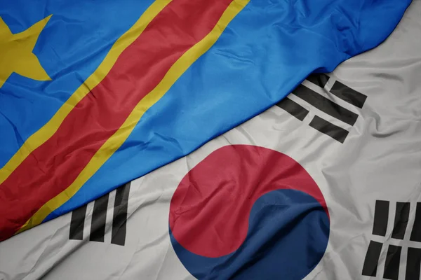 Waving colorful flag of south korea and national flag of democratic republic of the congo. — Stock Photo, Image