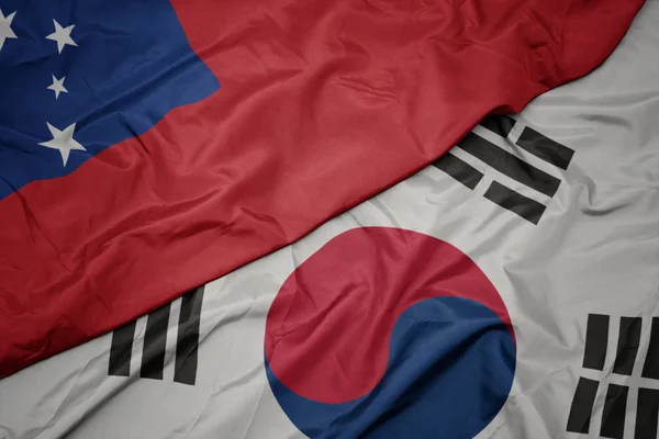 Falujące kolorowe flagi Korei Południowej i flagi narodowej Samoa ,. — Zdjęcie stockowe