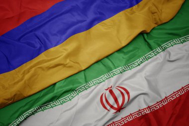 İran ve ermenistan ulusal bayrağı renkli bayrak sallayarak.