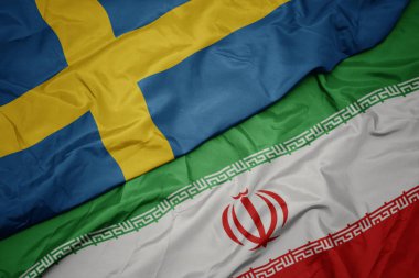İran ve İsveç ulusal bayrağı renkli bayrak sallayarak.