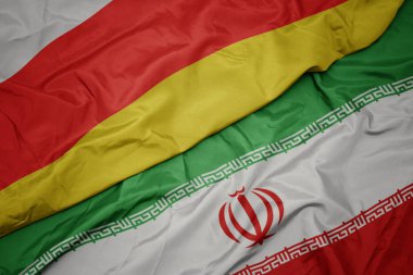 İran ve güney osetya ulusal bayrağı renkli bayrak sallayarak.