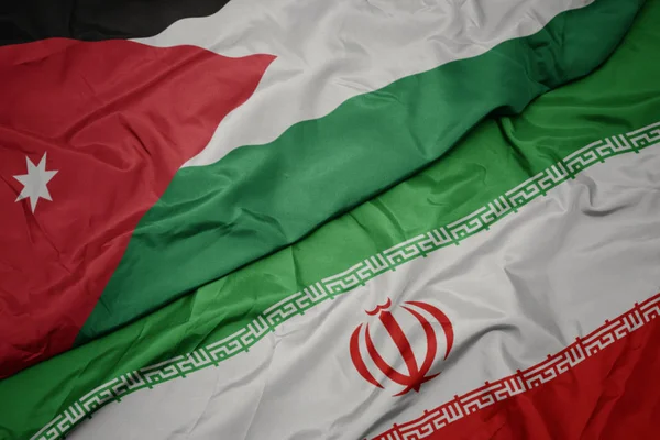 İran ve ürdün ulusal bayrağı renkli bayrak sallayarak. — Stok fotoğraf