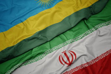 İran ve ruanda ulusal bayrağı renkli bayrak sallayarak.