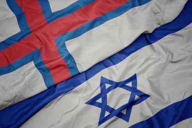 İsrail ve faroe adalarının ulusal bayrağı renkli bayrak sallayarak.