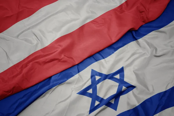 Κυματιστό χρώμα της σημαίας του Ισραήλ και της εθνικής σημαίας της Αυστρίας. — Φωτογραφία Αρχείου
