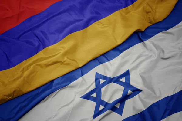 Ondeando colorida bandera de Israel y bandera nacional de Armenia . —  Fotos de Stock