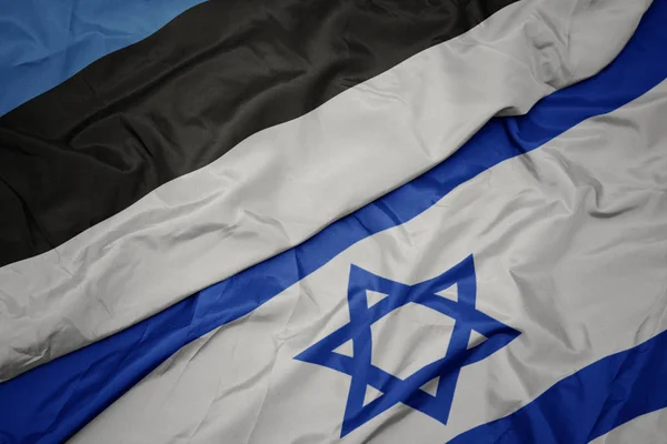 Waving colorful flag of israel and national flag of estonia. — Stock Photo, Image