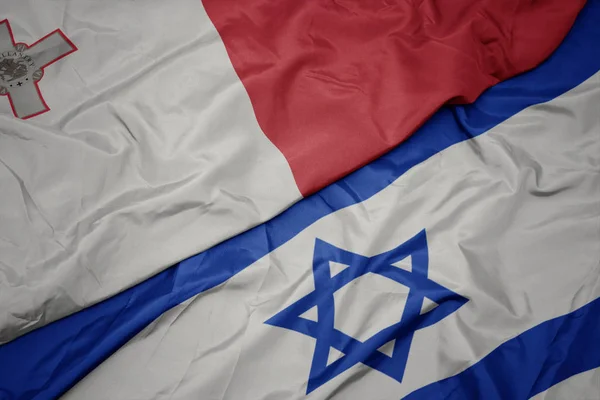 İsrail ve malta ulusal bayrağı renkli bayrak sallayarak — Stok fotoğraf