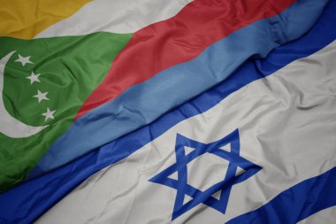 İsrail ve komor ulusal bayrağı renkli bayrak sallayarak.