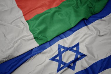 İsrail ve madagaskar ulusal bayrağı renkli bayrak sallayarak.