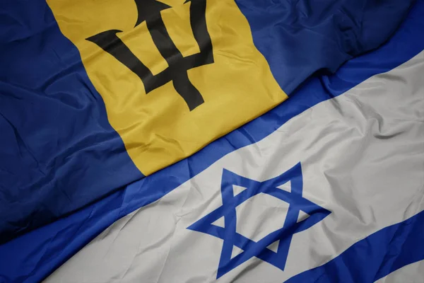İsrail ve barbados ulusal bayrağı renkli bayrak sallayarak. — Stok fotoğraf