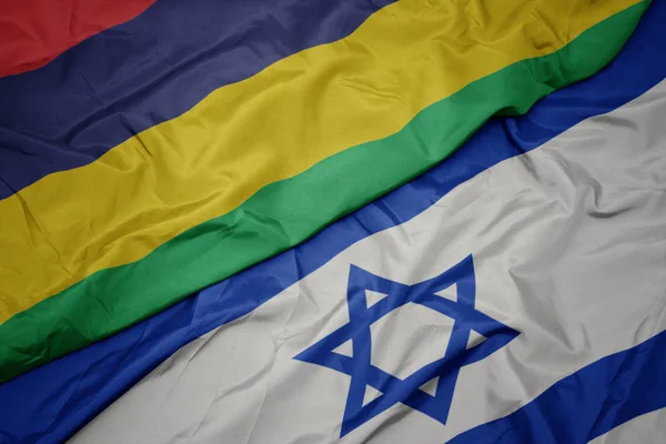 Waving colorful flag of israel and national flag of mauritius. — Stock Photo, Image