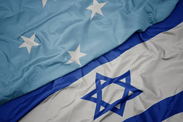 Ondeando colorida bandera de Israel y bandera nacional de los Estados Federados de Micronesia  . —  Fotos de Stock