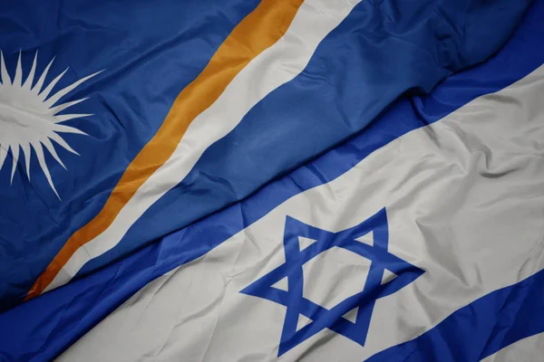 Ondeando colorida bandera de Israel y bandera nacional de Islas Marshall  . —  Fotos de Stock