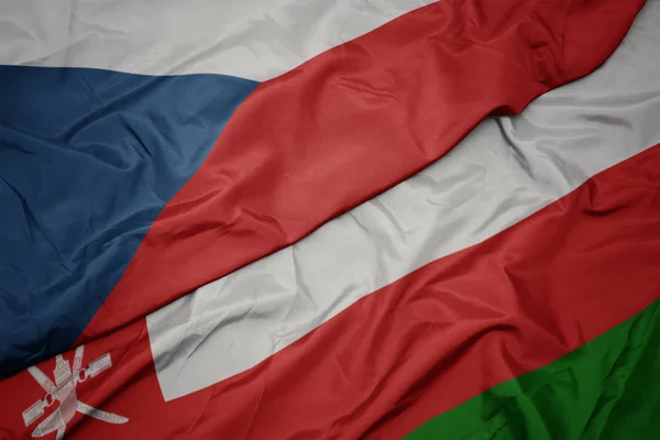 Az Ománi zászló színpompás zászlaja és a Cseh Köztársaság zászlaja. — Stock Fotó