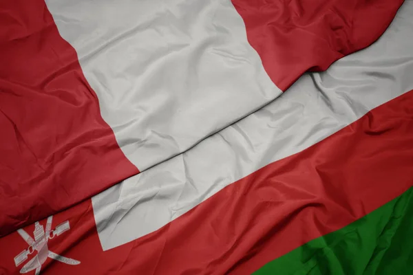 Az Ománi zászló és Peru nemzeti zászlaja. — Stock Fotó