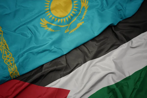 Waving colorful flag of palestine and national flag of kazakhstan. — Stock Photo, Image