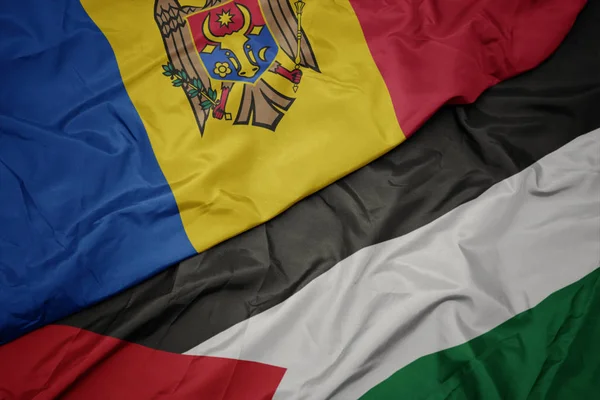 Waving colorful flag of palestine and national flag of moldova. — Stock Photo, Image