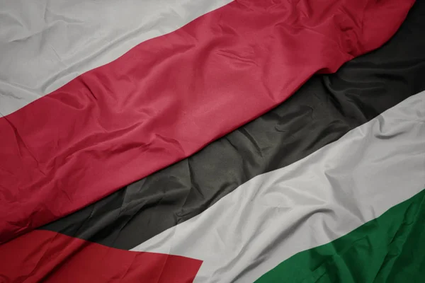 Waving colorful flag of palestine and national flag of poland. — Stock Photo, Image