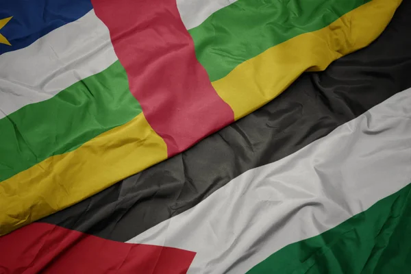 waving colorful flag of palestine and national flag of central african republic.