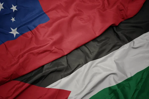 waving colorful flag of palestine and national flag of Samoa .
