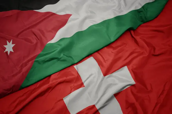 Macha kolorowy flaga Szwajcarii i flagi narodowej Jordanii. — Zdjęcie stockowe