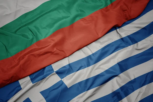 Waving colorful flag of greece and national flag of bulgaria. — Stock Photo, Image