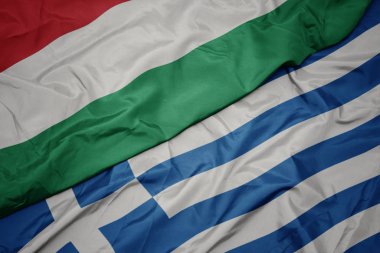 yunanistan ve macaristan ulusal bayrağı renkli bayrak sallayarak.