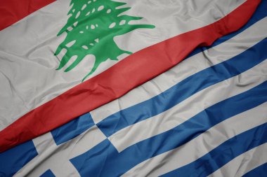 yunanistan ve lübnan ulusal bayrağı renkli bayrak sallayarak.
