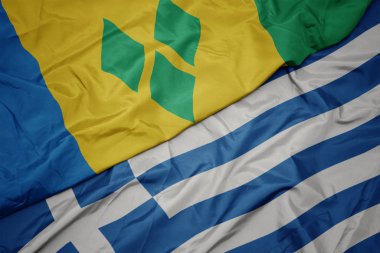 Yunanistan ve aziz vincent ve grenadinler ulusal bayrağı renkli bayrak sallayarak.