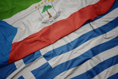 yunanistan ve ekvator ginesi ulusal bayrağı renkli bayrak sallayarak.