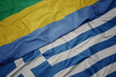 yunanistan ve gabon ulusal bayrağı renkli bayrak sallayarak.