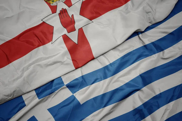 yunanistan ve kuzey İrlanda ulusal bayrağı renkli bayrak sallayarak.