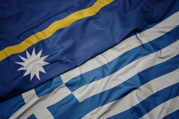 Waving colorful flag of greece and national flag of Nauru . — Stock Photo, Image