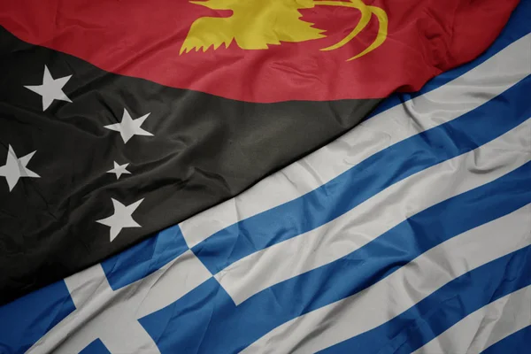 Waving colorful flag of greece and national flag of Papua New Guinea . — Stock Photo, Image