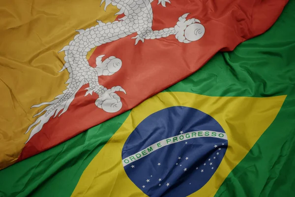 Waving colorful flag of brazil and national flag of bhutan. — Stock Photo, Image