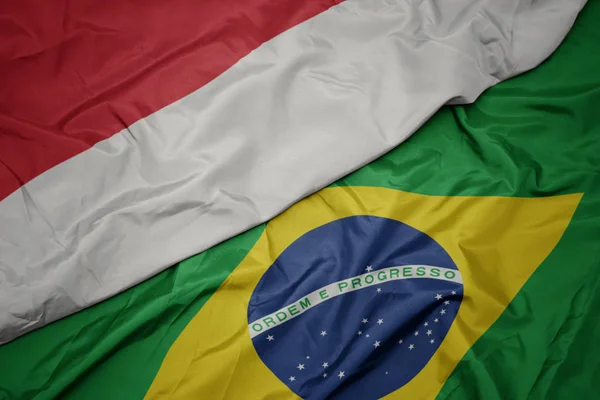 Waving colorful flag of brazil and national flag of indonesia. — Stock Photo, Image