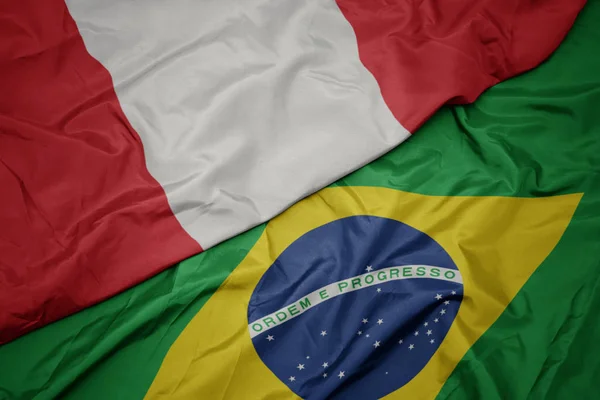 Waving colorful flag of brazil and national flag of peru. — Stock Photo, Image
