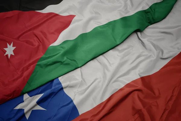 チリのカラフルな旗とヨルダンの国旗を振る. — ストック写真